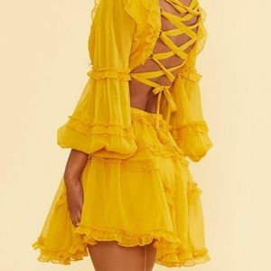 Yellow dress with lace up back, skater dress, material lace & sheer. Size small.